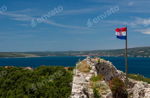 Preview: Croatian Flag Flies Above Ruins Of Old Venetian Fort Above The Coastal Town Of Novigrad In Croatia