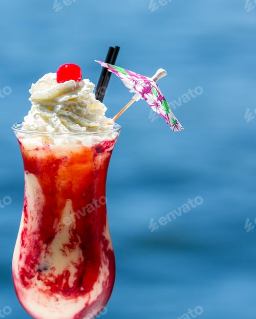 Preview: Refreshing Pina Colada Served With Blended Berries As A Garnish And Topped With Whipped Cream With