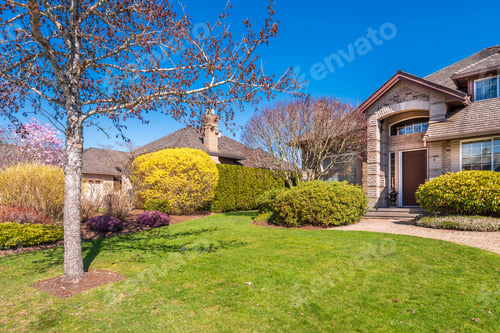 Preview: Beautiful Exterior Of Newly Built Luxury Home. Yard With Green Grass And Walkway Lead To Front