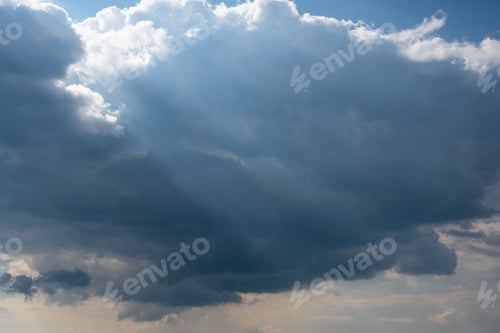 Preview: Sunrays Making Way Through Stormy Clouds In The Sky