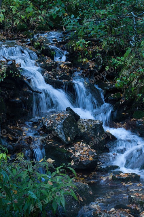 Preview: Natural Cascading Stream Outdoors Over Rocks