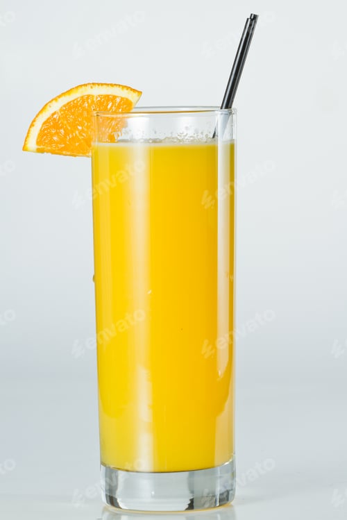 Preview: Closeup Of A Glass Filled With Fresh Orange Juice Isolated On A White Background
