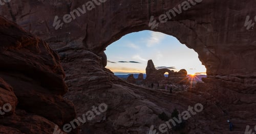 Preview: Arches National Park, Utah - December 28: Tourist Enjoying A Beautiful Sunset Behind Turret Arch