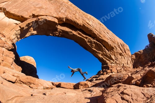 Preview: Man Pretending To Trip And Fall As A Concept To Be Be Careful While Hiking On The Slick Red Rocks