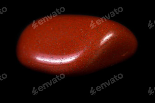 Preview: Close Up Of A Piece Of Polished Red Jasper Isolated On A Black Background