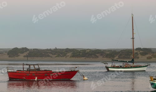 Preview: Red Boat In A Calm Anchorage In The Early Morning Hours