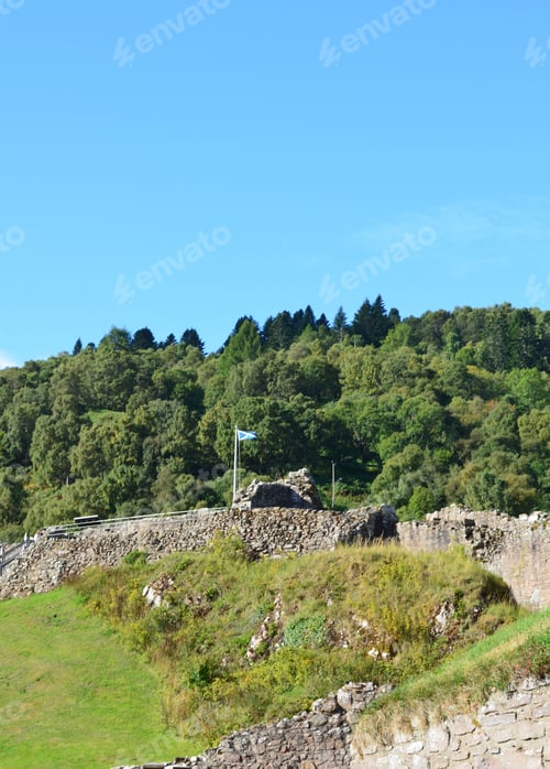 Preview: Flag Of Scotland Flying Over Urquhart Castle In Scotland.