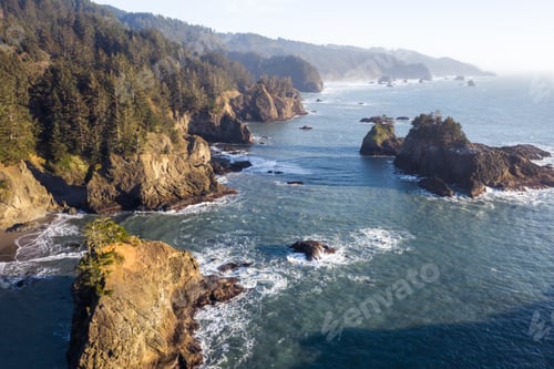Preview: Beautiful Landscape Classic Of The Oregon Coast With Islets Topped With Evergreen Trees And A Light