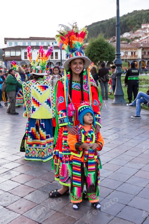 Preview: Cusco, Peru - May 13: Young Mother Posing With Her Child Dressed In Beautiful Colored Clothing