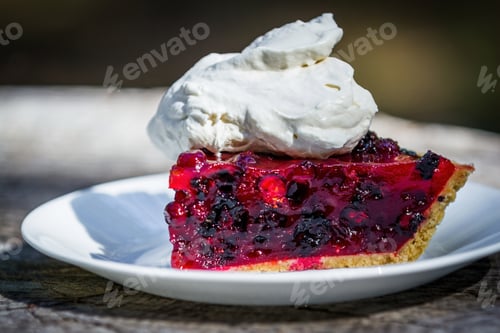 Preview: Close Up Of A Fresh Summer Berry Pie Made With Huckleberries And Blackberries With Red Gelatin On A