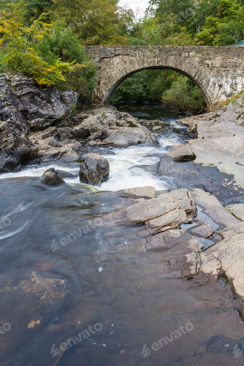 Preview: Beautiful Dochart Falls In Killin Scotland With Lots Of Rocks And Low Flow In The River In Autumn