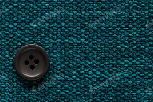 Preview: Clothes Sewing Button On A Blue Green Fabric Swatch Background