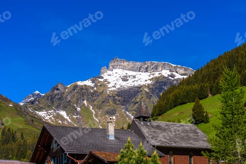 Preview: Beautiful Swiss Mountain Valley Landscape With A House Roof.