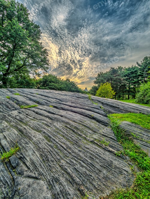 Preview: Central In The Early Morning With Large Boulder And Clouds