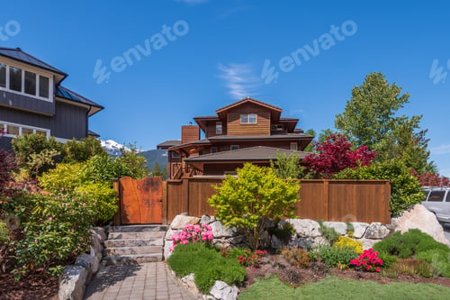Preview: Beautiful Exterior Of Newly Built Luxury Home. Yard With Green Grass And Stone.
