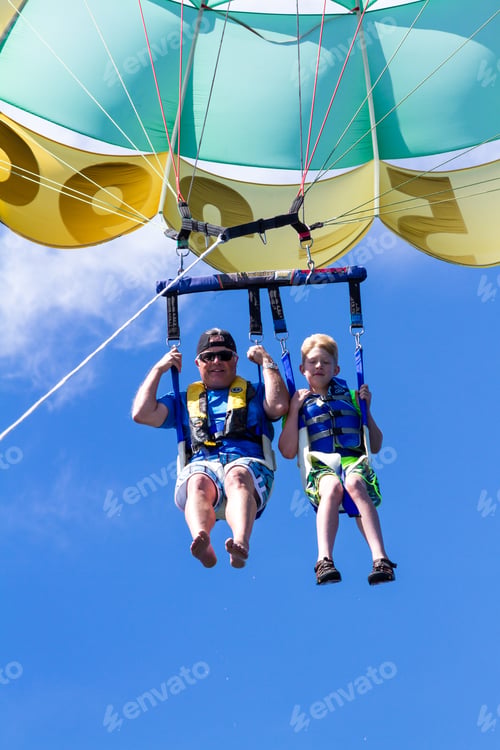 Preview: Coeur D' Alene, Idaho - August 12: Parasailing Adventure With People Enjoying The View. August 12