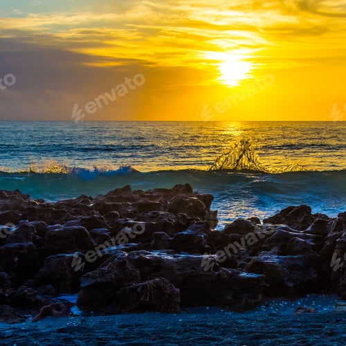 Preview: An Intricately Designed Splash In The Golden Sunrise On A Florida Rocky Beach.