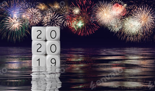 Preview: Calendar Blocks Showing 2019 Sinking Into The Ocean As 2020 Starts With Fireworks In The Background