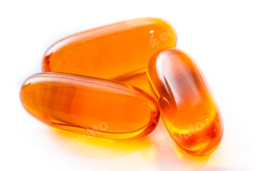 Preview: Close Up Of Salmon Oil Capsules Isolated On A White Background