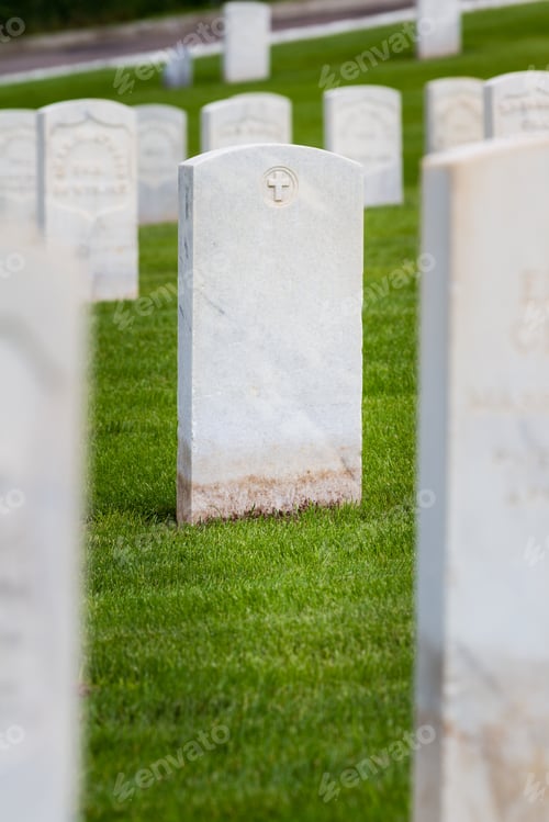 Preview: Rows Of Tombstones In A Military Graveyard With Bright Green Spring Grass