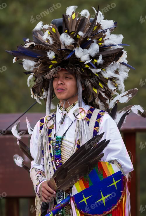 Preview: Crazy Horse Memorial, South Dakota - June 15 : Native American Performing For A Crowd In The Black