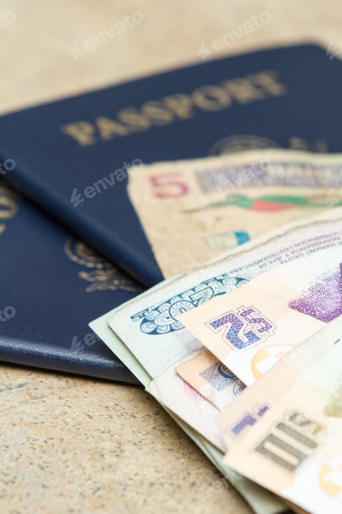 Preview: Travel Documents And Different International Currencies On A Counter Top