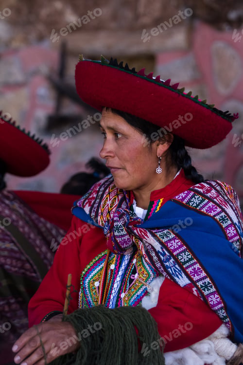 Preview: Chinchero Peru -May 18 : Native Cusquena Woman Dressed In Traditional Colorful Clothing Explaining