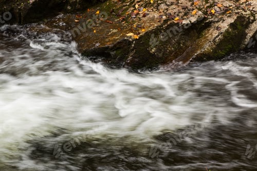 Preview: Cascading Water Over And Around Rocks Outdoors