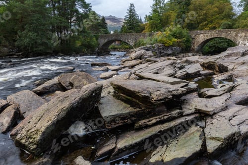 Preview: Beautiful Dochart Falls In Killin Scotland With Lots Of Rocks And Low Flow In The River In Autumn