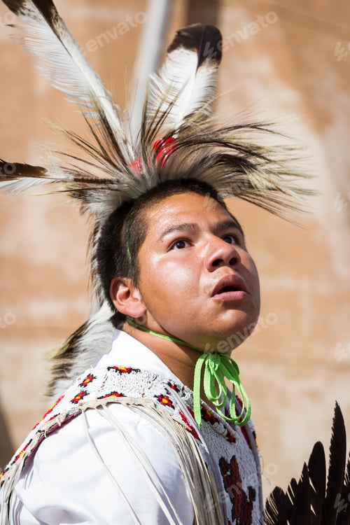 Preview: Crazy Horse Memorial, South Dakota - June 15 : Native American Performing For A Crowd In The Black