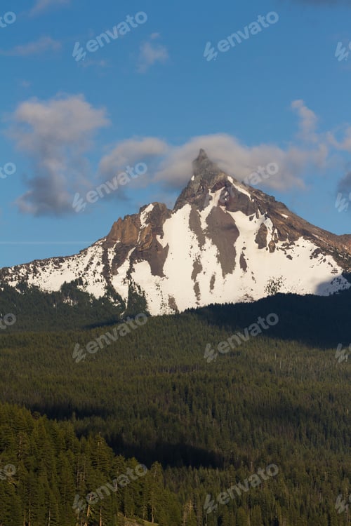 Preview: View Of Mount Thielsen In Oregon With Clouds And Fog Surrounding The Peak