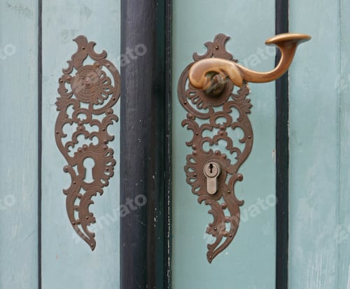 Preview: Detail Of Ornate Vintage Door Handle On A Pale Green Wooden Door