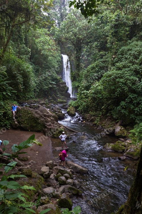 Preview: Alajuela, Costa Rica - May 02: Families And Friends Enjoying The View Of A Beautiful Waterfall In