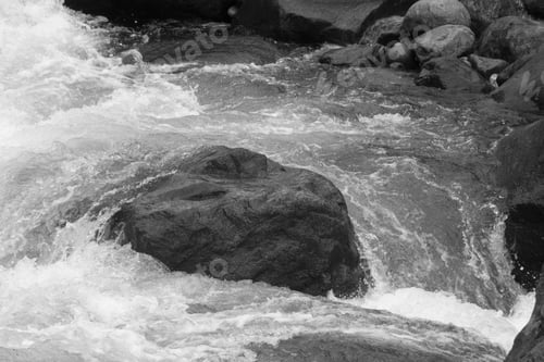 Preview: Stream Cascading By Rocks In Black And White