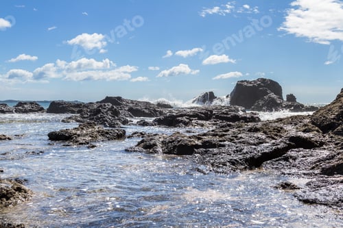 Preview: Relaxing Beach Scene In Playa Grande Costa Rica With Waves Crashing Into The Rocks With Crystal