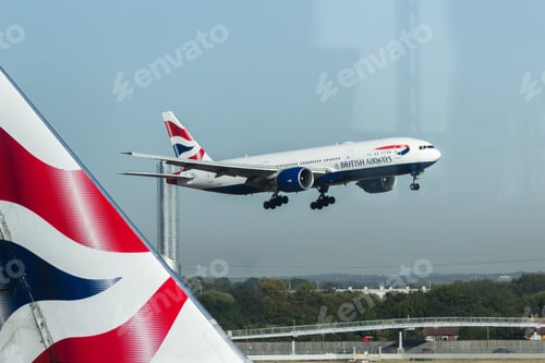 Preview: Heathrow, London Uk - September 19 2019: British Airways Plane Landing Viewed From The Lounge.