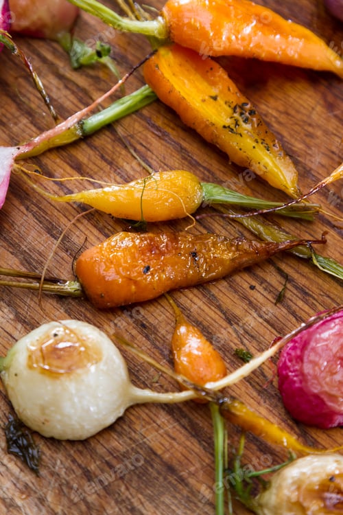 Preview: Fresh Baby Carrots And Radishes Roasted And Seasoned With Oil And Spices