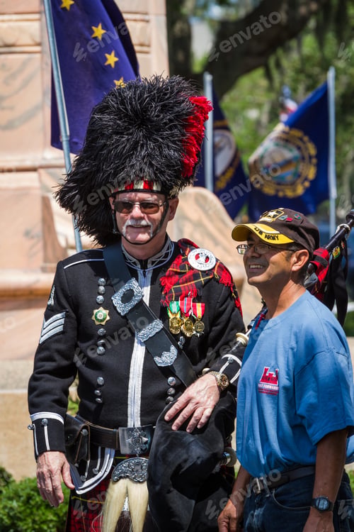 Preview: Bay Pines, Florida - May 26 : Bagpiper And Navy Veteran Posing For A Photo After The Memorial Day