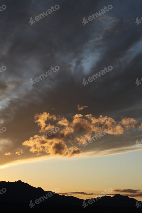 Preview: A Mountain Ridge-Line Silhouette Against A Sky Of Bright Fiery Colors 5496