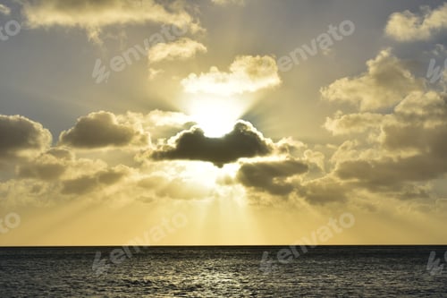 Preview: Beautiful Sun Shining Through A Large Group Of Clouds In Aruba.