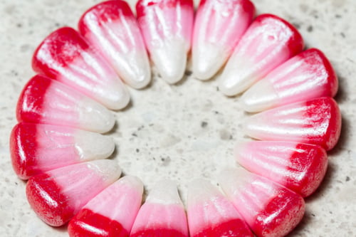 Preview: Pink Seasonal Candy Corns Arranged Into A Circle For Concept Or Background