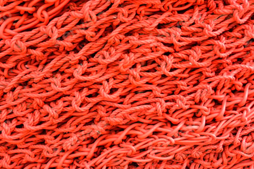 Preview: Red Textured Background Of Painted Chains And Ropes