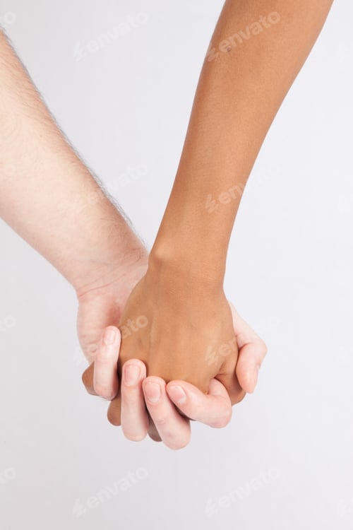 Preview: A Black Woman And White Man Holding Hands