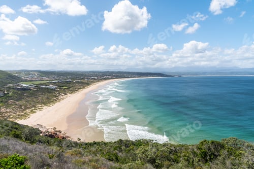 Preview: Landscape Photo Of A Long Beach With Houses And Turquoise Waters. Waves Crashing In The Sand And