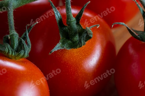 Preview: Close Up Of A Vine Ripen Tomato Still On The Vine With A Gorgeous Red Color And Smooth Firm Texture
