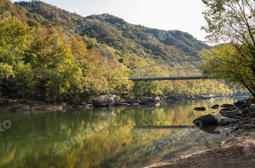 Preview: Reflections In The Calm Water Under The Fayette Station Bridge Over New River In West Virginia