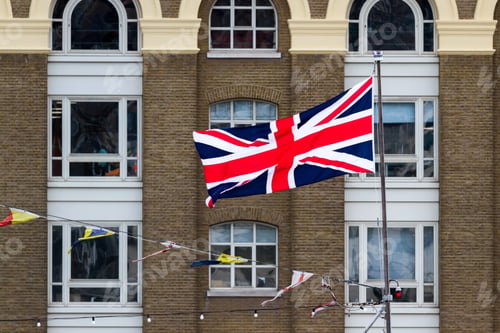 Preview: Close Up Of The Union Jack Flag In London With Old Brick Buildings In The Background