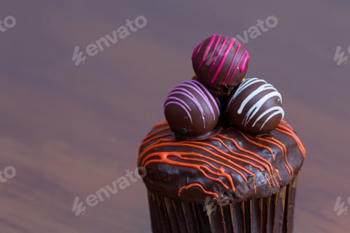Preview: Delicious Chocolate Truffle Cupcake Garnished With Colorful Swirls