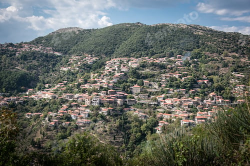 Preview: Full View Of Mountain Village Of Lagkadia Nested In The Forest , Greece.