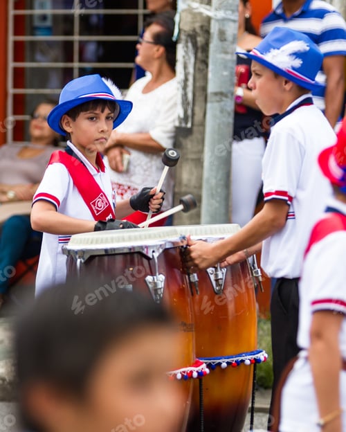 Preview: Tilaran, Costa Rica - September 15 : School Children Marching In The Town Square Playing Percussion